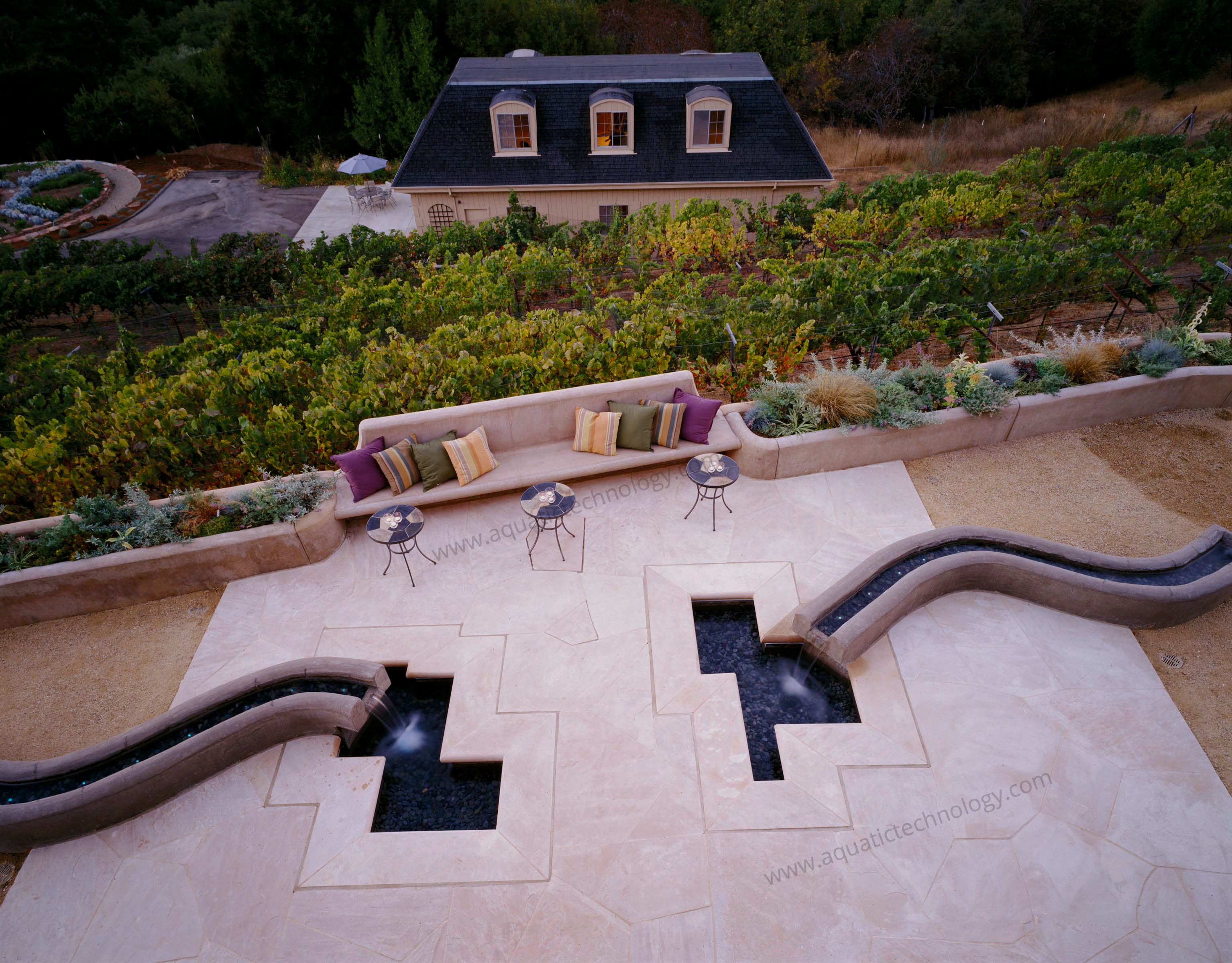 Colored concrete water features bench planters